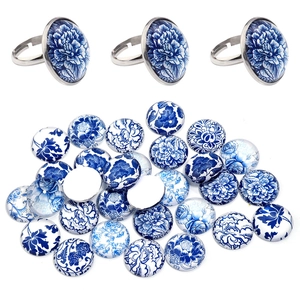 Detail of blue and white porcelain glass cabochons with adjustable silver ring bases
