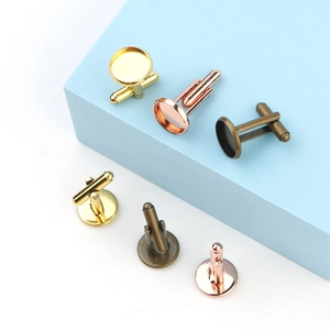 Macro view of round rose gold and bronze cufflink bezel blanks for DIY jewelry