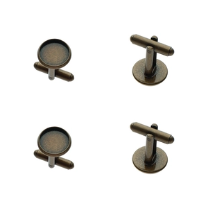 Macro detail of bronze round cufflink bases with T-bar closures for DIY jewelry