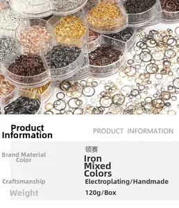 Détail d'anneaux de jonction en fer multicolores pour bijoux DIY dans une boîte à 7 compartiments