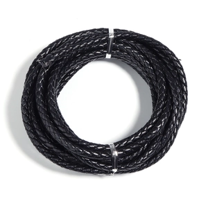 Macro detail of 6mm black braided PU leather cord roll for DIY jewelry making