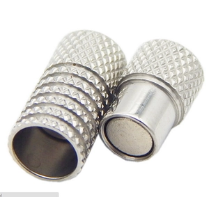 Macro detail of stainless steel magnetic clasps with knurled texture for DIY jewelry making
