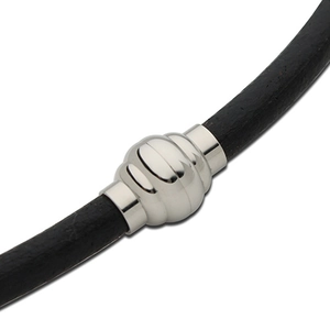 Macro shot of silver magnetic clasp on black leather cord for DIY jewelry making
