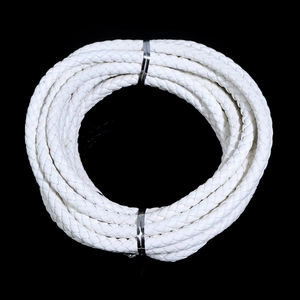 Macro detail of 6mm white braided PU leather cord roll with silver metal fasteners