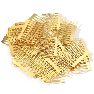 Close-up of golden 10-tooth metal hair combs for DIY bridal headpiece craft supplies