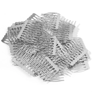 Macro shot of silver metal hair comb components for DIY bridal headpiece making