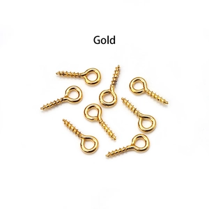 Detailed view of bulk gold plated eye pins for DIY jewelry making and craft projects