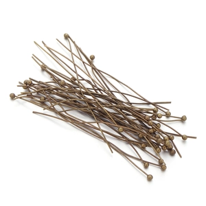 Macro view of vintage bronze ball head pins for DIY jewelry making accessories