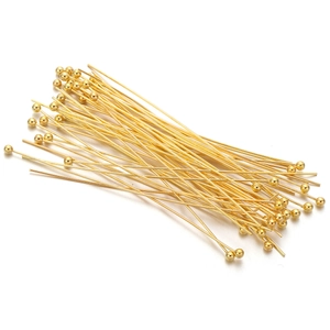 Detailed view of polished golden ball head pins for professional DIY jewelry making