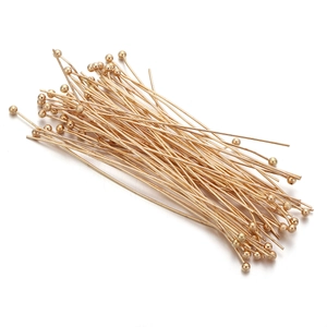 Macro detail of gold plated copper ball head pins for professional DIY jewelry making