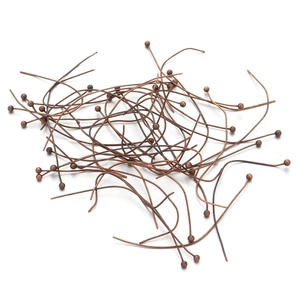 Macro shot of antique bronze ball headpins for DIY jewelry making and handmade beading
