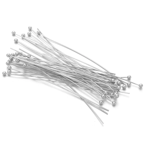 Macro view of silver-plated ball head pins for professional DIY jewelry making crafts