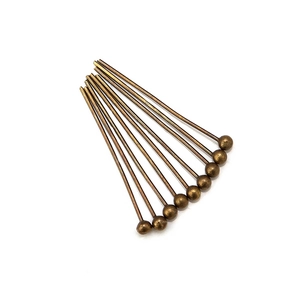 Detail of 10 antique bronze ball head pins for DIY jewelry making and handmade crafts