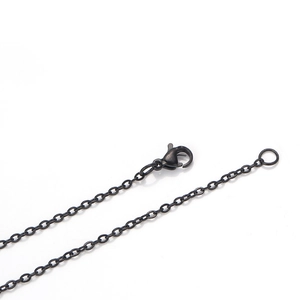 Detail of black stainless steel flat cable chain necklace with lobster clasp closure
