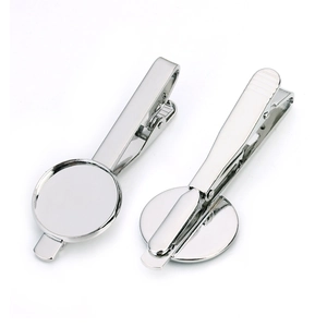 Detailed view of silver tie clip with circular blank tray for DIY jewelry making