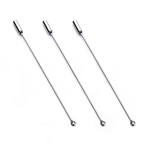 Set of three silver metal long lapel pins with round beads and safety caps on white background