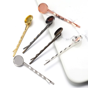 Macro shot of assorted metal hair pin trays for DIY hair accessories in five colors
