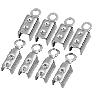 Close-up of polished stainless steel cord end crimp connectors for DIY jewelry making