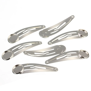 Detailed view of silver metal DIY snap hair clips with round flat base for bead sticking