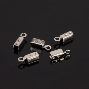 Macro shot of stainless steel cord end crimps with side holes and loop for DIY jewelry