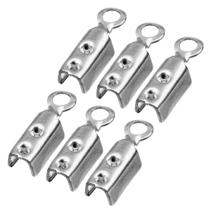 Close-up of stainless steel leather cord end crimps for DIY jewelry making