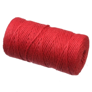Macro detail of red 3-strand 2mm hemp rope roll with natural fiber texture for DIY crafts