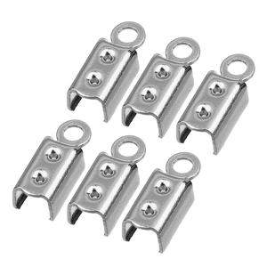 Detail shot of silver stainless steel crimp ends for jewelry making cord connectors