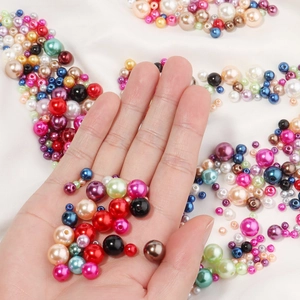 Macro shot of colorful ABS imitation pearls in various sizes for DIY jewelry crafting