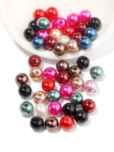 Macro shot of assorted colorful pre-drilled ABS craft pearls for DIY jewelry making