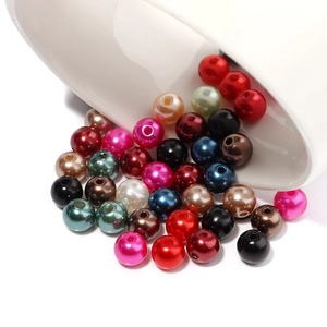 Macro shot of assorted colorful ABS faux pearls with holes for DIY jewelry making