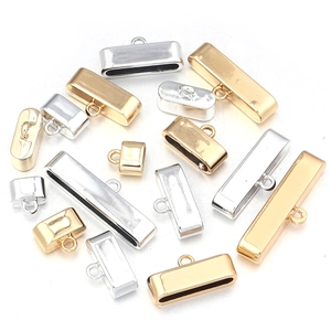 Detail of alloy cord end caps in gold and silver finish for DIY jewelry making crafts