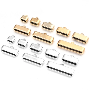Detailed macro view of assorted gold and silver metal end caps for DIY jewelry making