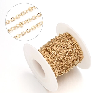 Detail view of gold-plated stainless steel satellite bead chain on a white spool for DIY jewelry