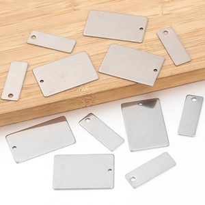 Blank rectangular stainless steel pendant tags for DIY jewelry making on wooden base