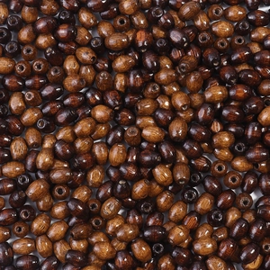 Macro shot of oval wooden barrel beads with natural grain for DIY jewelry making