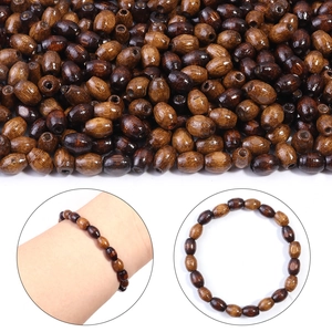 Macro view of oval wooden beads with natural grain and glossy finish for DIY bracelets