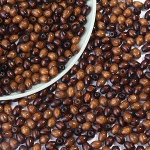 Macro view of oval wooden beads with natural grain in deep and medium brown tones