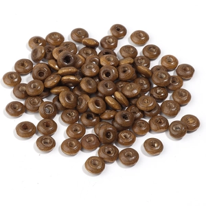 Close-up of polished brown wooden abacus beads with natural grain for DIY jewelry