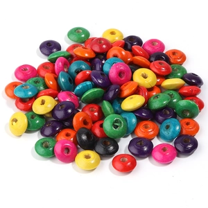 Macro shot of colorful abacus-shaped wooden spacer beads for DIY jewelry making