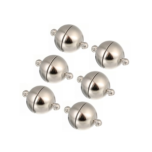 Detailed view of silver spherical magnetic clasps with double rings for jewelry making