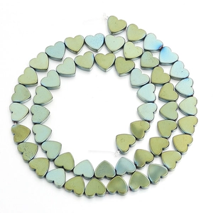 Macro view of metallic iridescent heart beads with electroplated finish for DIY jewelry