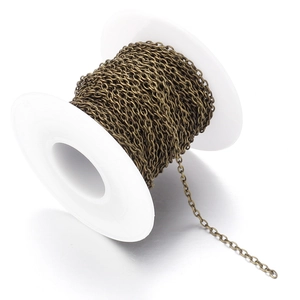 Macro detail of 2mm bronze flat O-chain roll for DIY jewelry making and craft projects