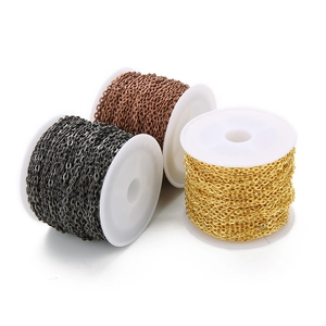 Flat oval link chains in gold, copper, and black on spools for DIY jewelry making