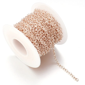 Detailed view of rose gold O-chain roll for DIY jewelry making with fine metal links