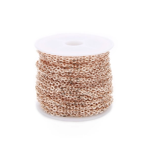 Macro shot of rose gold plated flat oval link chain on spool for DIY jewelry making
