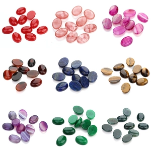 Detailed grid of polished oval gemstone cabochons in various natural colors and textures
