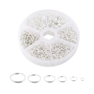 Detailed macro view of 6-size silver split rings set for DIY jewelry with clear organizer