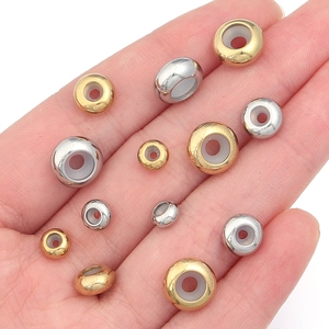 Perles d'arrêt en acier inoxydable doré et argenté avec inserts en silicone variés
