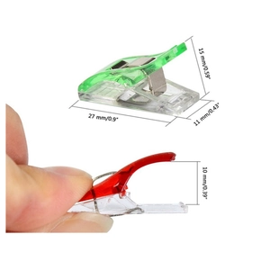 Macro detail of sewing clips with 27mm length dimensions and opening mechanism view