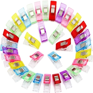 Circle arrangement of colorful plastic sewing clips with strong metal springs